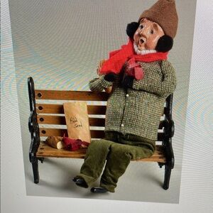 Cozy Winter Sculpture with Red Scarf and Brown Hat